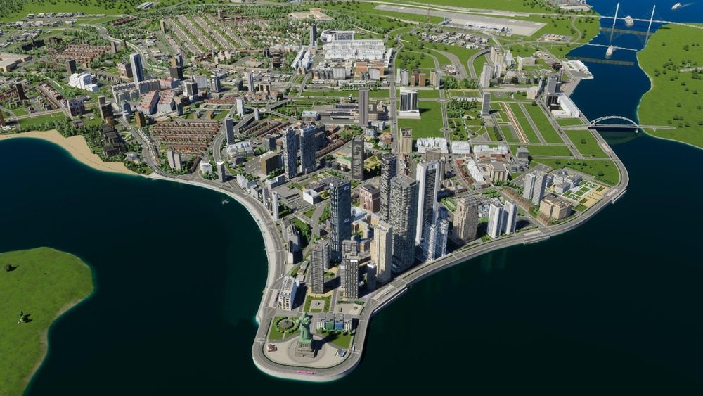 A screenshot of Cities Skylines 2 focusing on a panoramic view of a medium high rise coastal city