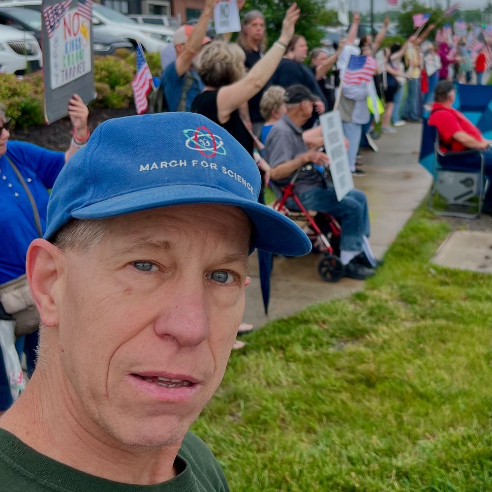 Me at No Kings protest with my March for Science hat. 