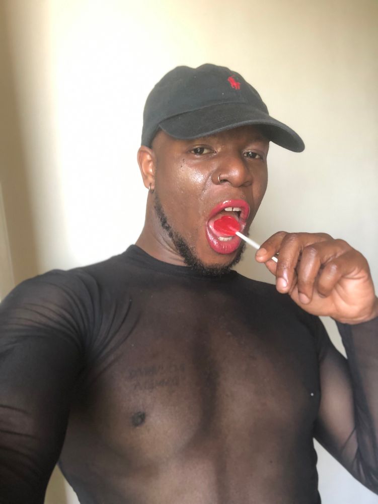 in this picture i put the lollipop in my mouth and i'm licking it