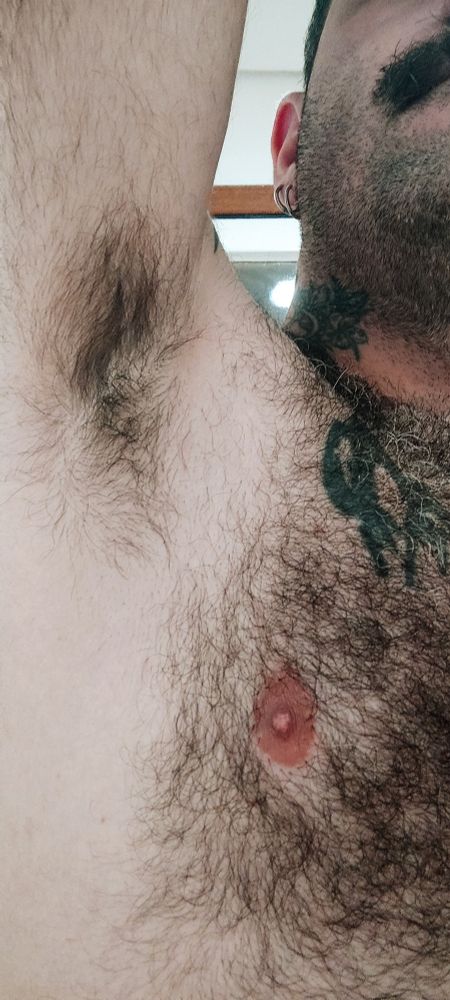 Close-up of my right armpit and aome of my chest and face. My armpit and chest are very hairy.