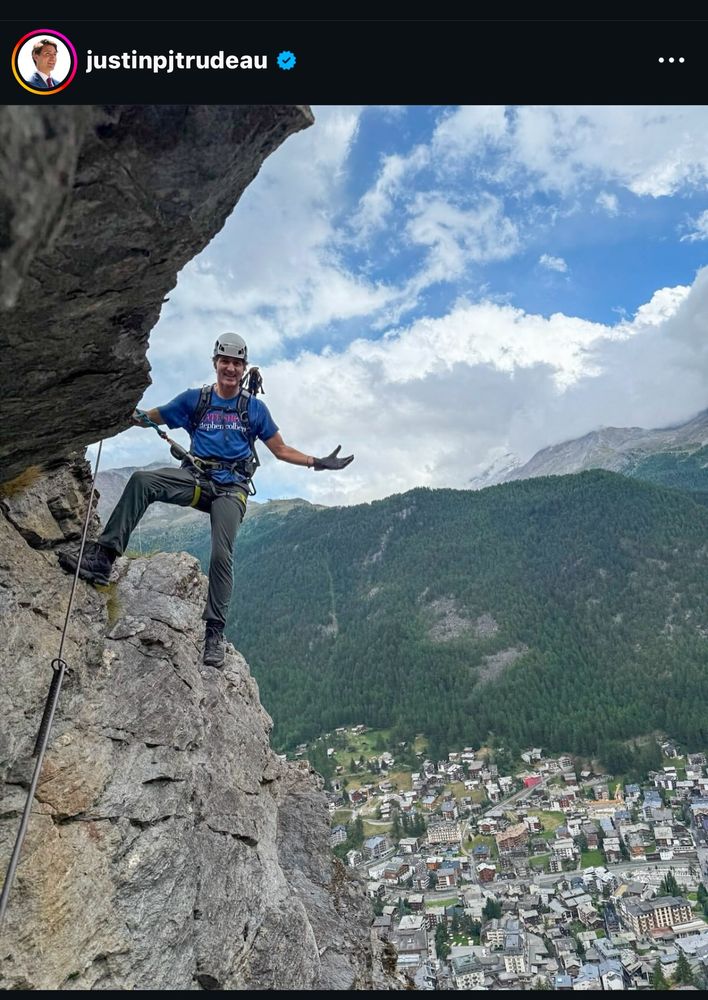 Former Prime Minister of Canada, Justin Trudeau, wearing a Stephen Colbert shirt while in Switzerland with one of his sons. 
