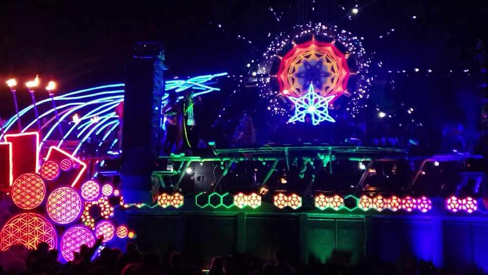 Mira and female techno DJ from Germany playing on Mayan Warrior art car at Burning Man. 