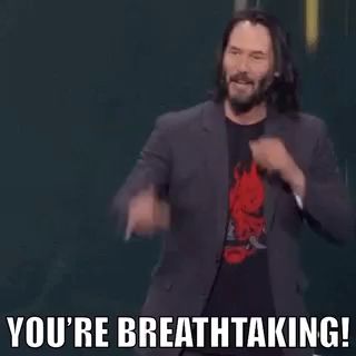 a man in a suit and a red shirt is saying `` you 're breathtaking '' .