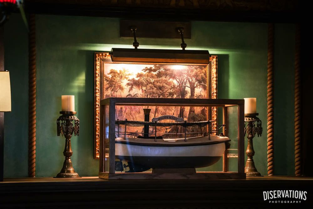 Painting and a model boat at Skipper Canteen in Magic Kingdom