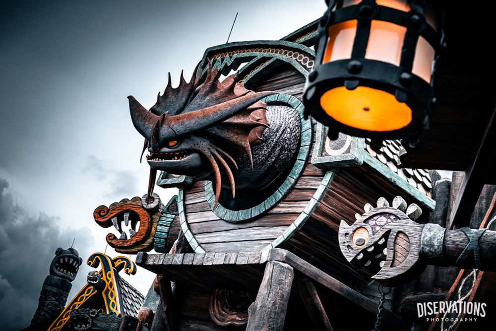 Dragon peeking out of his Isle of Berk home