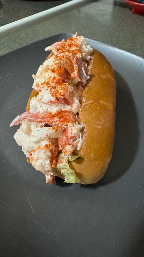 A lobster roll on a plate. 