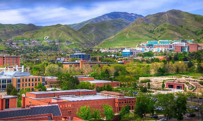 University of Utah campus, green mountains and red buildings. 