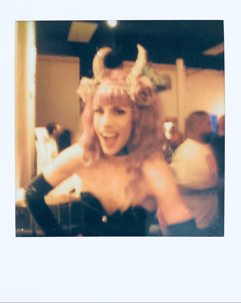 polaroid photo of Matthew Rodriguez AKA "Miss Matte" dressed up in drag and striking a pose