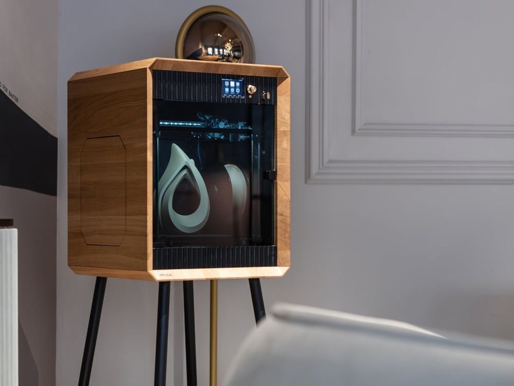 Prusa Signature Oak 3D printer in a well lit white room