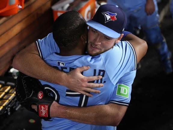 Trey and Vladdy embrace each other. 