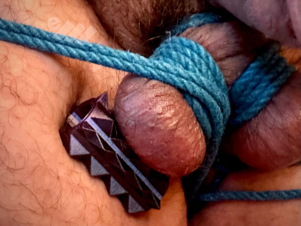 There’s some testicles, some rope wrapped around them, and some pokey spikey things pressing into them. Ouch? Yes. But the human attached to the tortured scrotum was loving every bit of this. How delicious. 