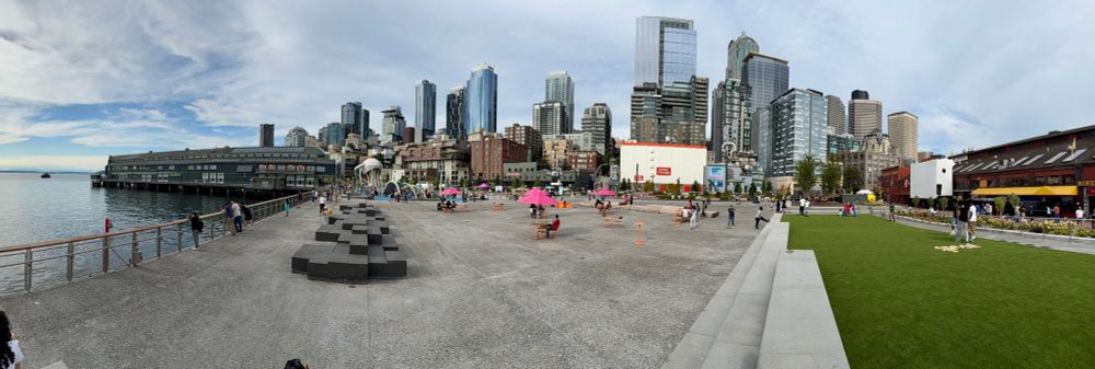 Panorama of the newly opened public pier with a large patio with seating 