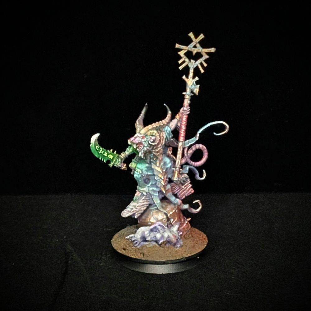 A painted miniature of a Skaven Grey Seer from Age of Sigmar.