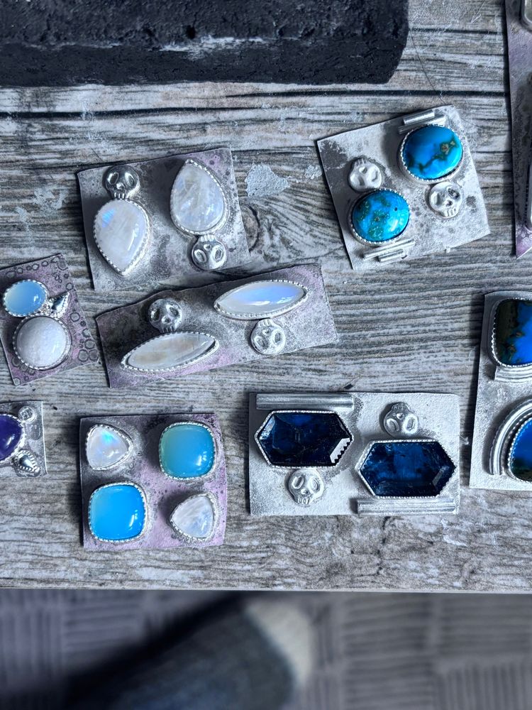 In progress shot of some new gemstone earrings I am working on. There are some light blue chalcedony, a bunch of moonstones and all of them have skull accents. These are all sterling silver.