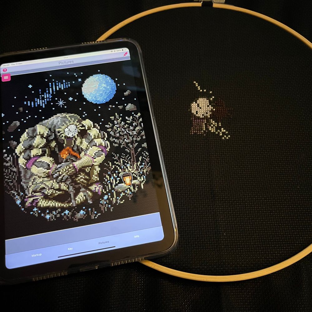 cross stitch pattern of esquie and maelle hugging from clair obscur: expedition 33. on the left is the pattern on my ipad and on the right is current progress in stitches 
