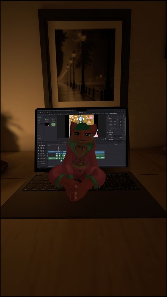 My sona sitting on a laptop