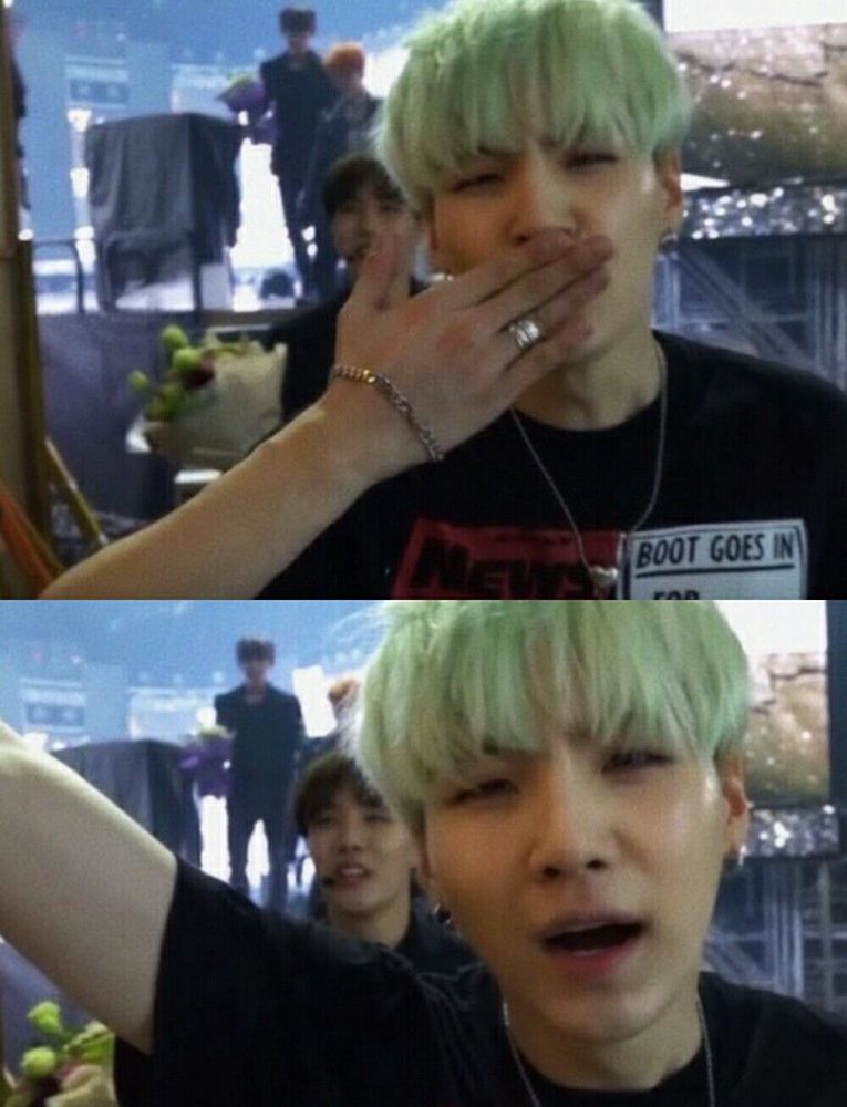 photo of silver-ringed mint yoongi blowing a kiss to the camera 