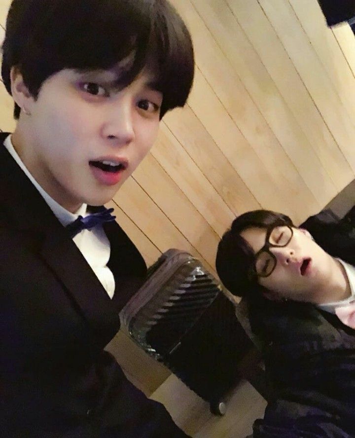 jimin selca with a sleeping yoongi. he’s sitting with his head tilted back, mouth open. bro is SLUMPED 