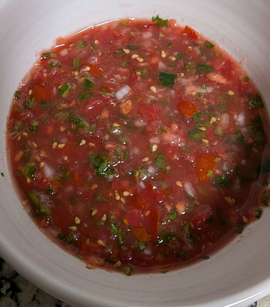 A fresh tomato salsa in a small bowl.