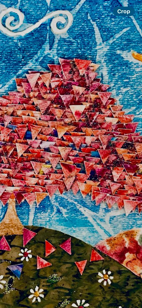 Close up detail of a mixed media piece on watercolour paper of a pink tree with leaves made of tiny cut out triangles.