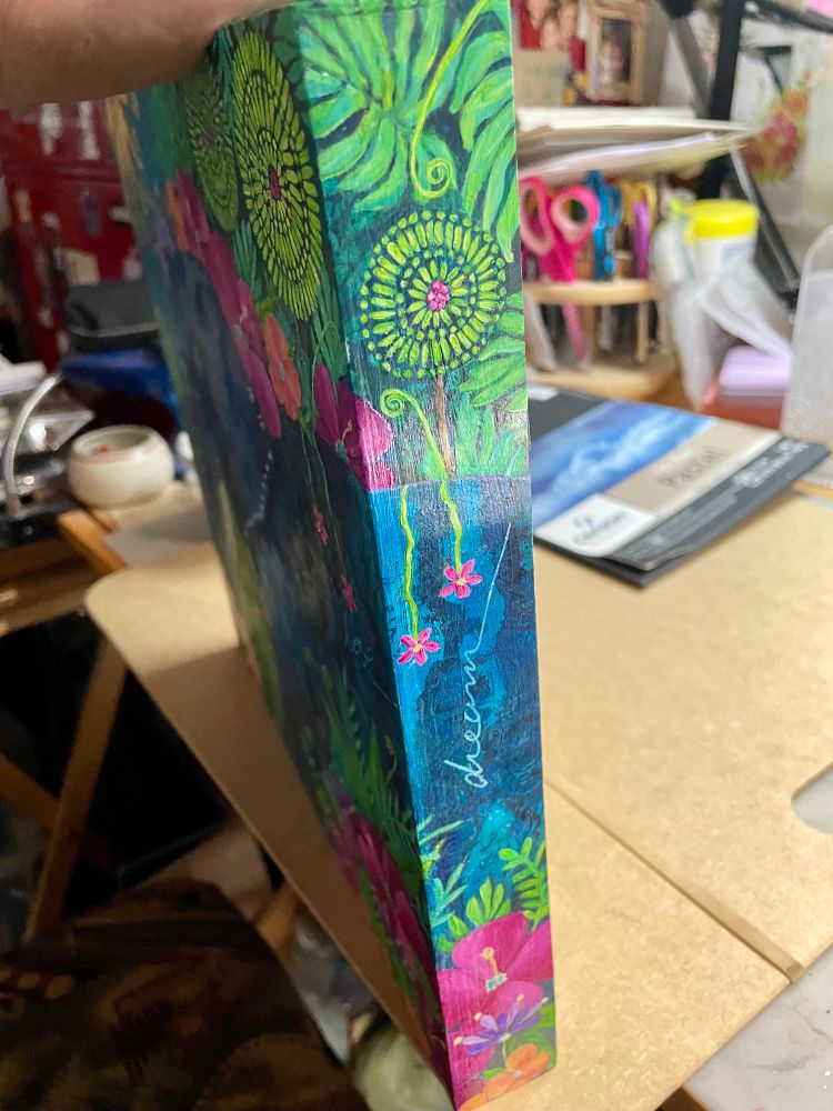 Side view of a colourful acrylic tropical themed painting. 