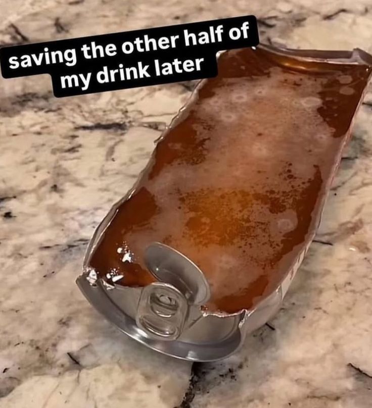 aluminum can cut in half vertically and laying flat, full of a gelatin like substance. Mold is seen on the surface growing in little circles scatter from top to bottom. 
