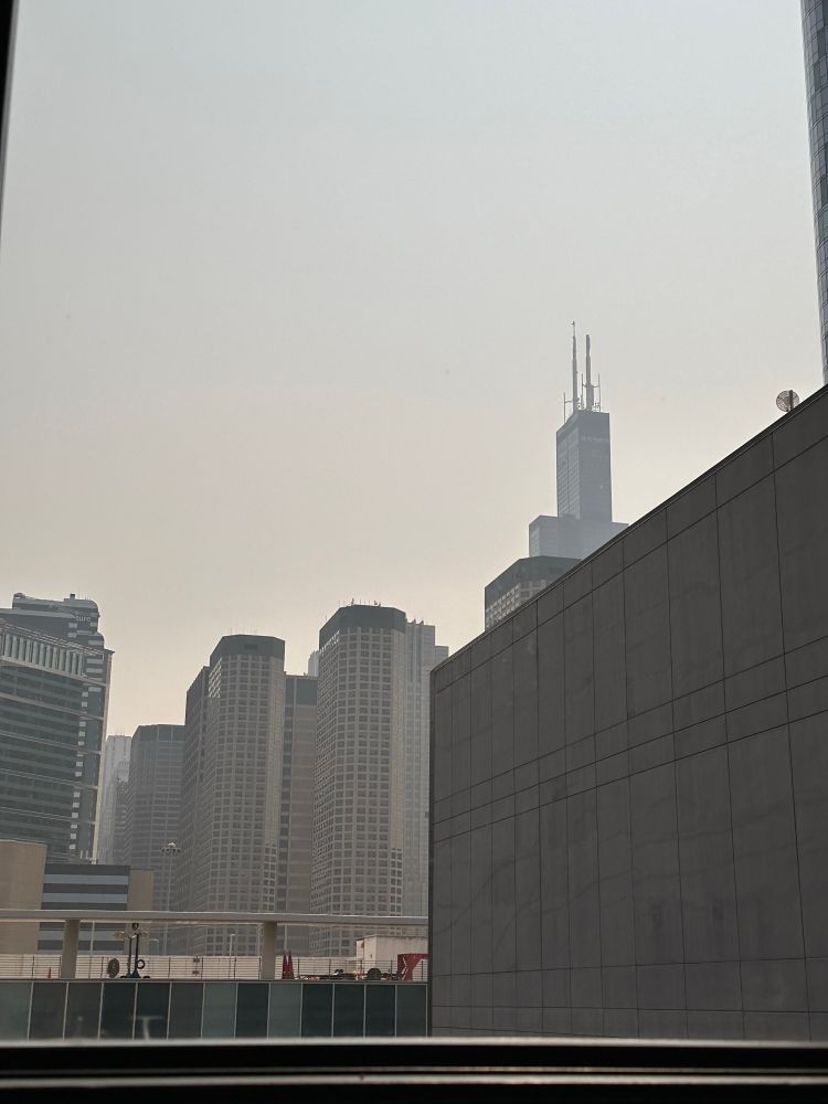 a picture of the Sears tower and other Chicago high rises in a smoky haze 