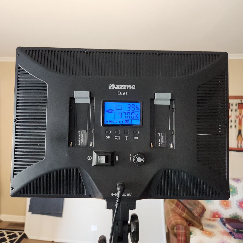 Sarah uses a pair of Dazzne D50 lights in the process of documenting her quilts. Here the back of one light is visible with its various controls. 