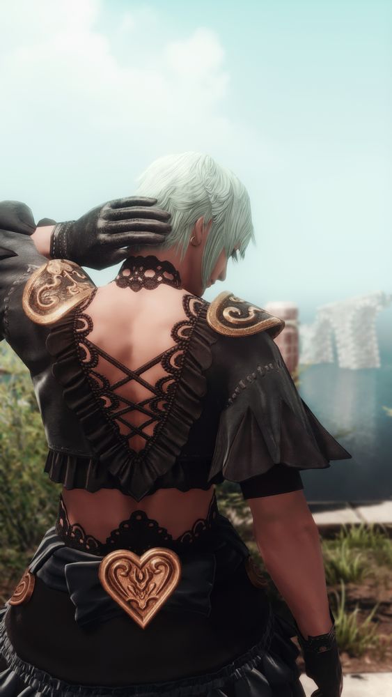 Sicard is dressed in black top that looks like short dress with lace? There is a golden heard at lower back. His back is turned to camera and leather gloved hand on back of his neck. Cannot really tell if he is pleased or annoyed. Probably both!