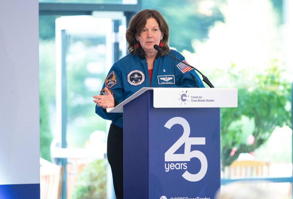 Photograph of Dr Cady Coleman at last year's CCBC annual conference. She is wearing her regulation NASA uniform.