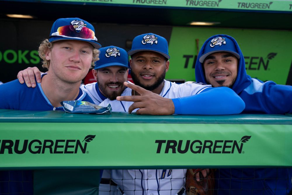 Joey Wiemer, Nick Loftin, Nelson Velázquez and Harold Castro posing in the dugout.

Photo: Minda Haas Kuhlmann