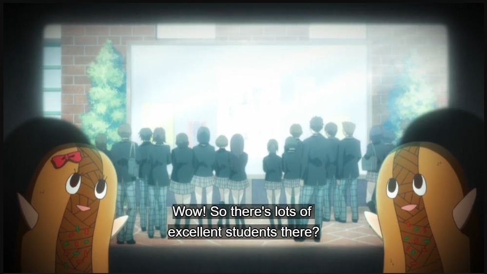 Two Yakisoba mascots standing in front of a projected screen with the anime Yamada-kun and the Seven Witches playing in the screen.