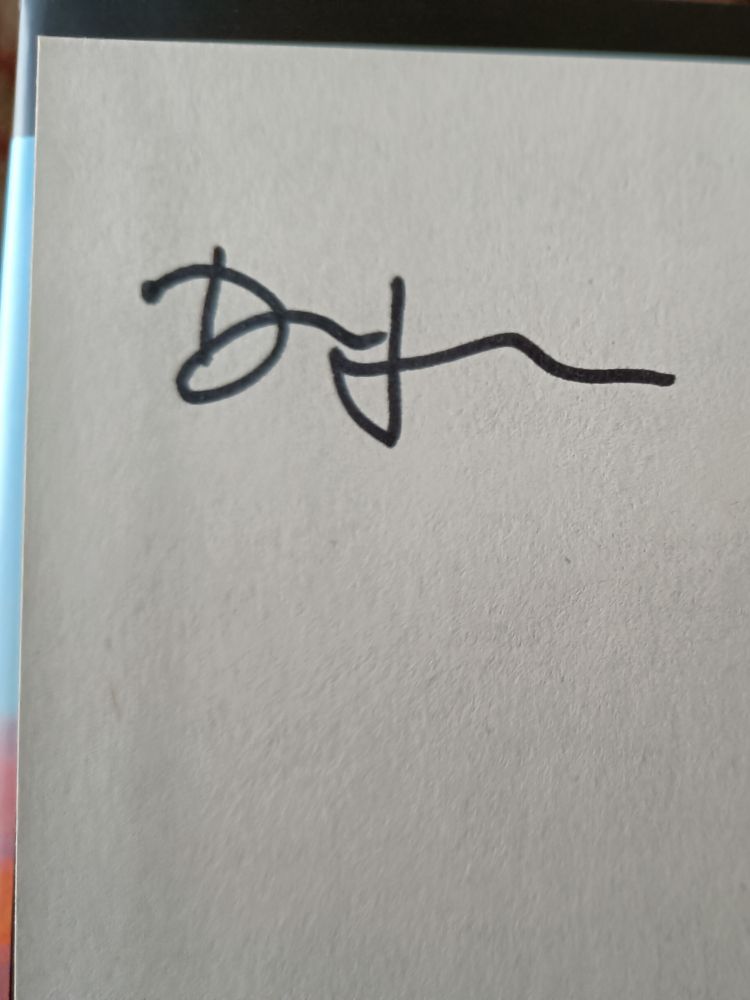 Signature de Dan Houser à l'intérieur du livre A Better Paradise.