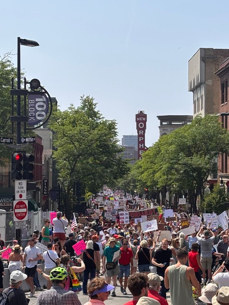 the front of the no kings march in madison, Wi approaching the state Capitol. state street is filled with protesters from the Capitol building to UW Madison library mall