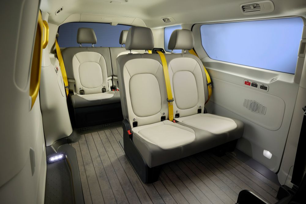 Interior view of the Volkswagen ID. Buzz AD robotaxi showing its four seats and unique controls for passengers. 