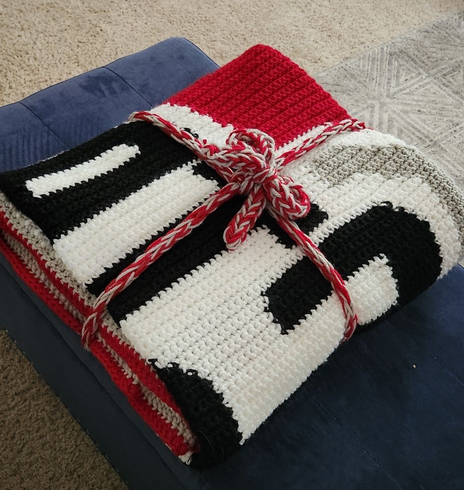 OSU afghan folded with crocheted bow