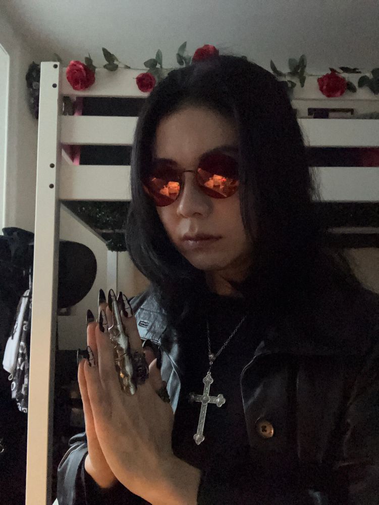 Vinnie dressed as Ozzy Osbourne with hands in prayer 