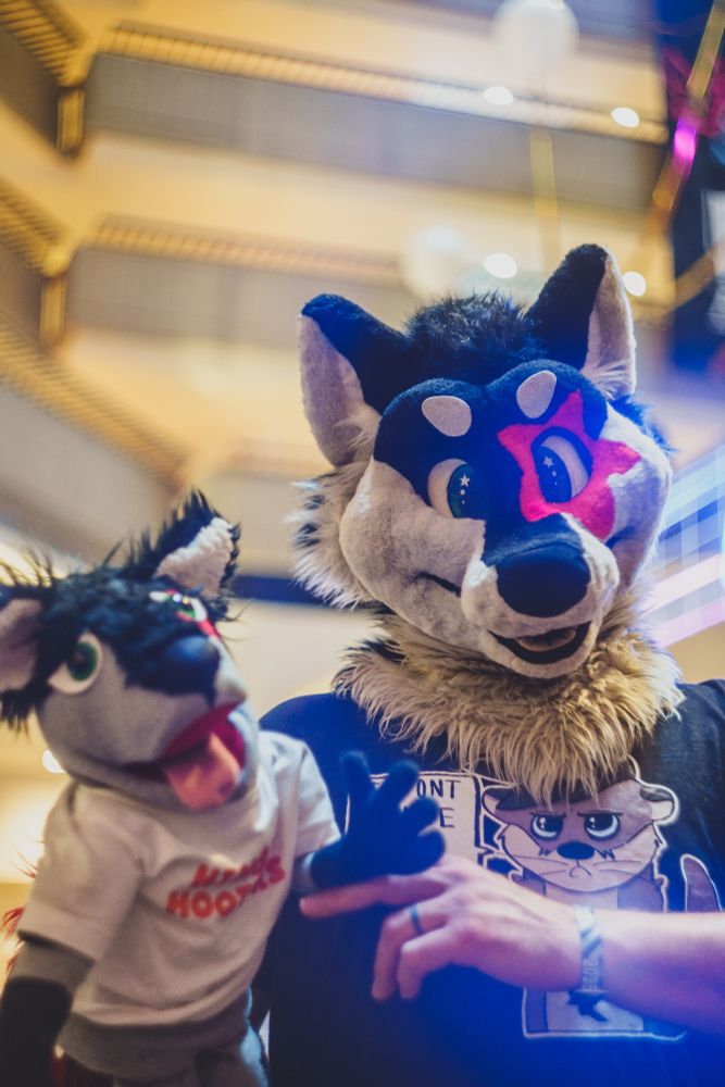 Forrest with his puppet with the FWA PEEE sign at the back