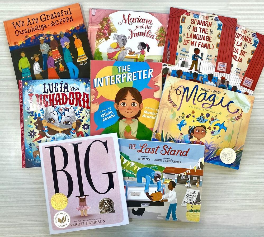 A collection of children's books displayed on a table.