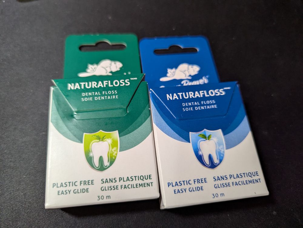 Two boxes of dental floss, from the brand Green Beaver.