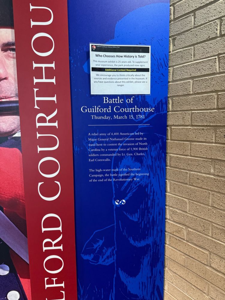 Interpretive sign asking "Who Chooses How History Is Told?"