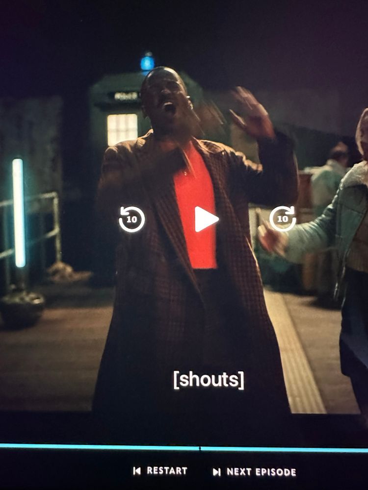 Screenshot from Dr Who of the 15th Doctor with the caption: shouts