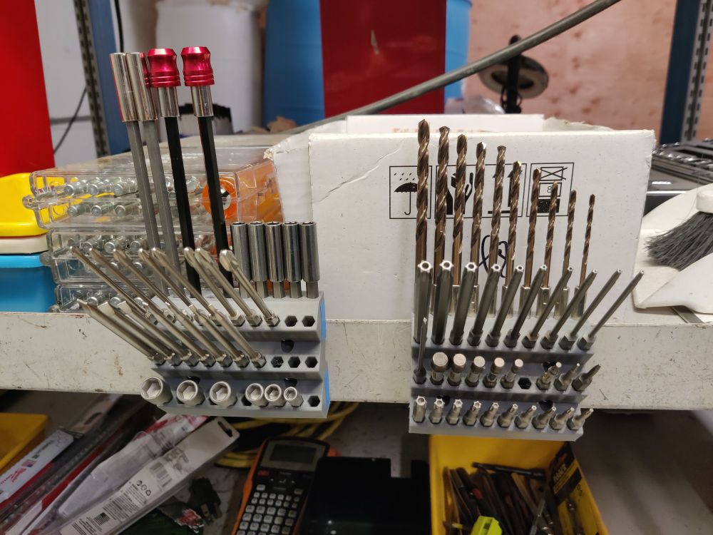 Drill bits displayed in 3D printed organizers. 