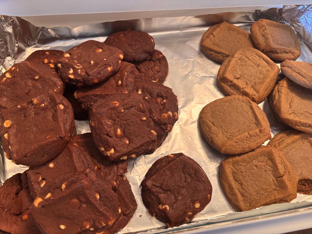 A box of peppermint cocoa and gingerbread cookies.