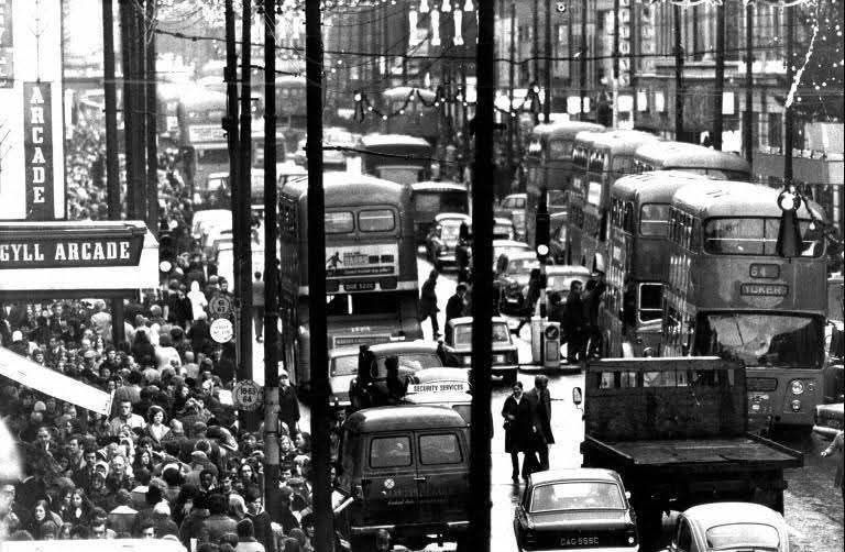 Argyle St, Glasgow, full of people and traffic in 1972.