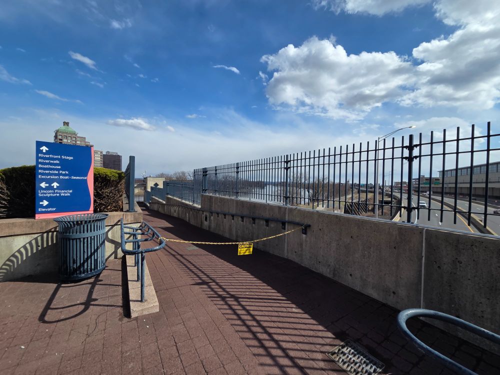 The ramp down to the riverwalk has a locked chain across it.