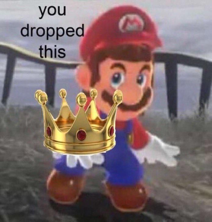 nintendo mario holds a crown in his right hand saying "you dropped this"