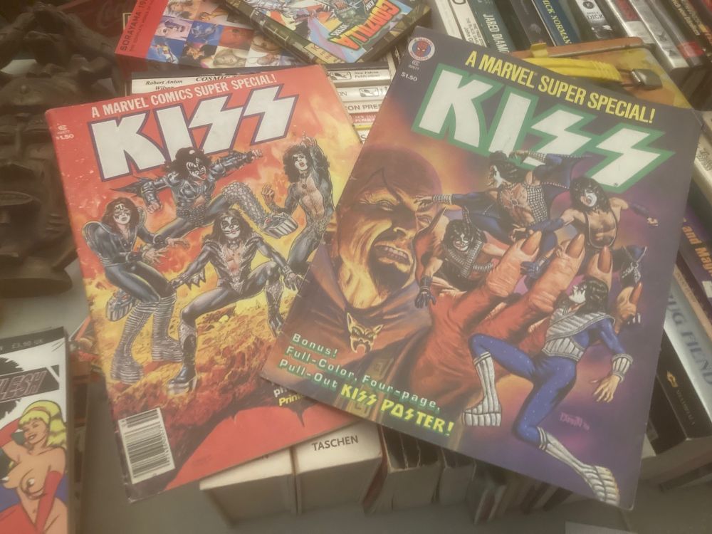 Marvel Comics Super Specials of KISS 1 & 2 cover art.  i copied so many images from these learning to draw as a kid.  i had so much KISS shit.  i bought any magazine that had even the tiniest mention of them.  2 trapper folders full of pics and mags.  don't know where those got to tho.