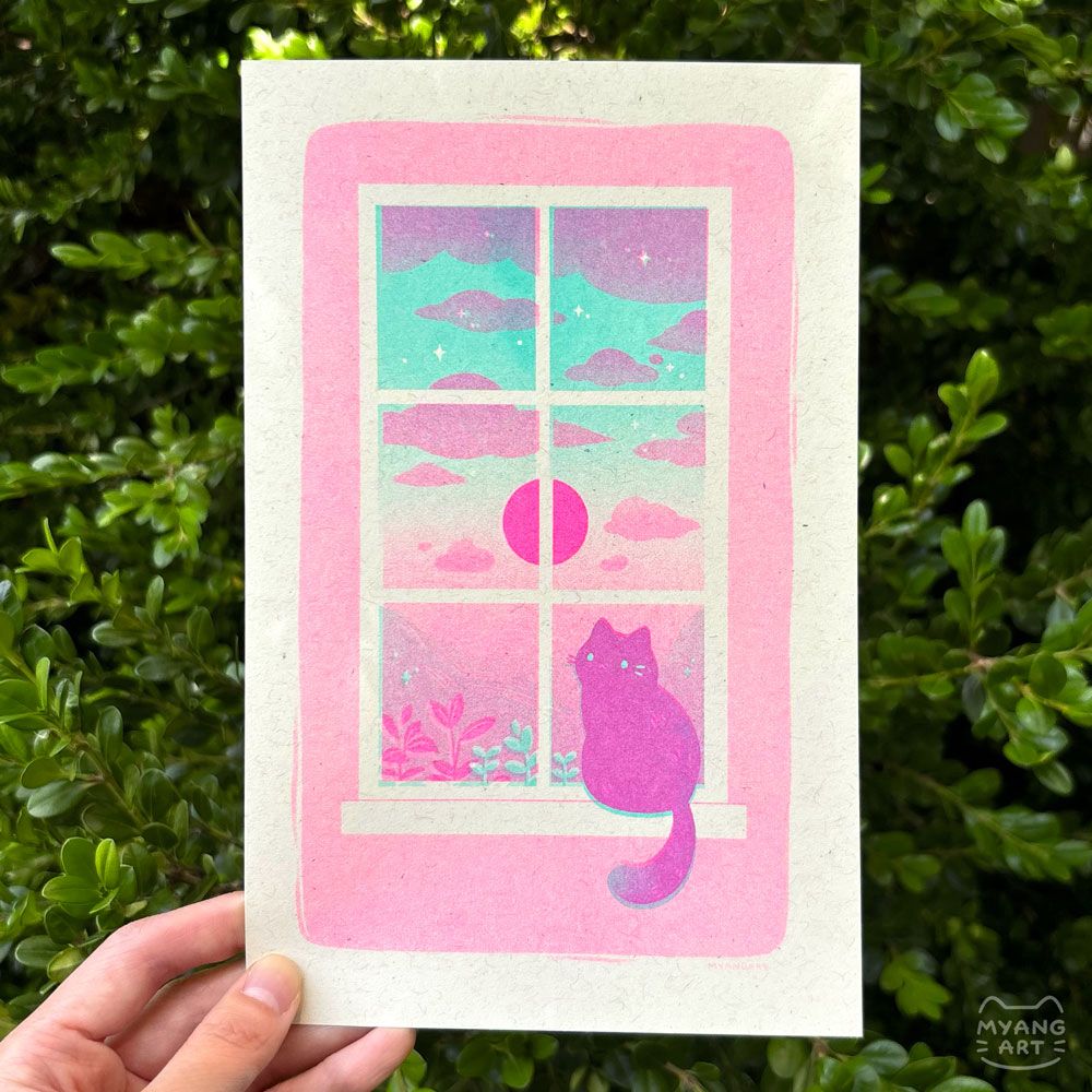 Risograph print of a dark colored cat sitting on a windowsill, with its head turned toward the viewer. Outside the window, a bright pink sun is centered with purple clouds above and plants and hills below. The sky is a gradient going from mint at the top to purple at the bottom. The image sits on a medium pink background, with white bordering the edges. Inks used are fluorescent pink and mint. 