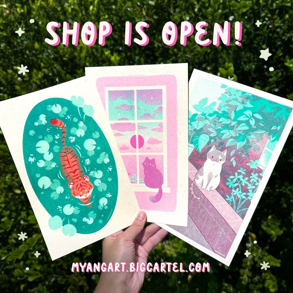 Promotional image for my shop update. A hand is holding three riso prints in a fan formation. The first is a drawing of a tiger in a lily pond, the second is a cat sitting on a windowsill at sunset, and the third is a cat sitting on a stone wall in front of a garden. The text at the top reads “SHOP IS OPEN!” and text at the bottom reads “MYANGART.BIGCARTEL.COM”. 